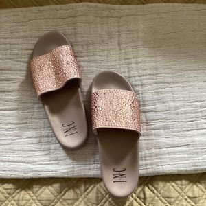 INC rose gold slides